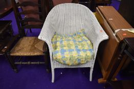 A Lloyd Loom tub chair