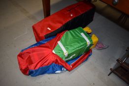 A pair of Hauck travel cots