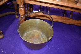 A traditional brass jam pan