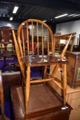 A stained frame hoop and stick back carver chair