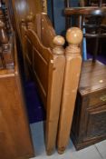 A modern natural pine double bedstead