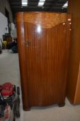 A mid 20th Century mahogany and walnut small robe, having selves and glazed top interior section,