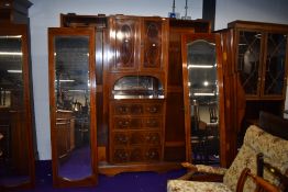 An early 20th Century mahogany and inlaid wardrobe/press of large proportions, labelled Maple and