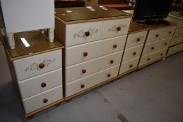 A selection of laminate pine effect bedroom furniture comprising two sets of drawers and a pair of