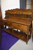 A reproduction oak low dresser, Titchmarsh and Goodwin or similar quality, width approx. 142cm