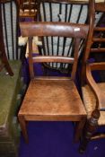 A 19th Century sold seat rail back dining chair