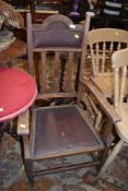 An early 20th Century oak Arts and Crafts style carver chair