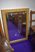 A reproduction gilt frame wall mirror, approx. 64 x 95cm
