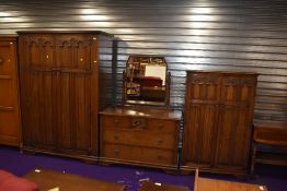 An early to mid 20th Century dark oak , Priory style three piece bedroom suite comprising double