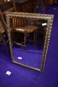 A reproduction gilt frame wall mirror, approx. 52 x 77cm