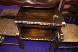 An early 20th Century dark stained oak fold over occasional card table