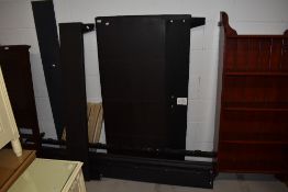 A brown leatherette double double bed frame