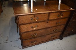 A 19th Century oak chest of two over three drawers, having later, but still period brass drop