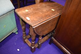 A small oak occasional drop leaf table