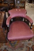 A late 19th/early 20th Century tup chair having later pink dralon upholstery