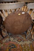 An early 20th Century oak firescreen/folding table