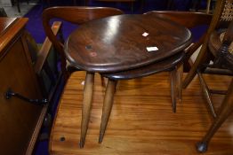 A two table dark stained nest by Ercol, width of largest table, width approx. 49cm