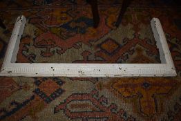 A vintage painted cast fire fender, internal dimensions approx. 72 x 30cm