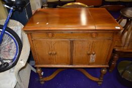 A vintage HMV gramophone in double cabinet, labelled model number 261, width 78rpm records and
