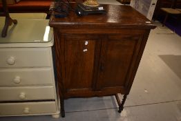 An early 20th Century oak cabinet, interior and back removed, width approx. 69cm