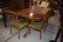 A nice quality reproduction extending dining table and set of six (four +two regency dining