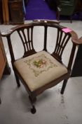 A period oak corner smokers bow style chair having tapestry seat, previously wormed and treated