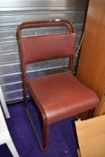 Twenty Seven (27) vintage utility style chairs having metal frames