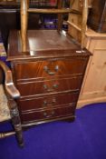A reproduction Regency two drawer filing cabinet