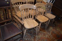 A set of six beech kitchen chairs having solid seats