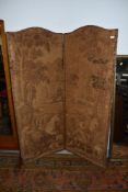 A vintage two panel room divider, having damask style hunting and foliate decoration and leather