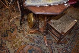 A Victorian stained frame octagonal occasional table on turned column frame and triple legs