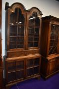An early 20th Century oak bookcase, having double dome top, interesting design, width approx. 100cm,