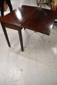 A traditional mahogany fold over tea table, approx. 90 x 45cm closed, opens to 90 x 90cm
