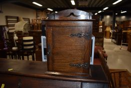 A traditional oak smokers cabinet