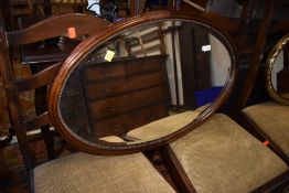 An early 20th Century oval wall mirror
