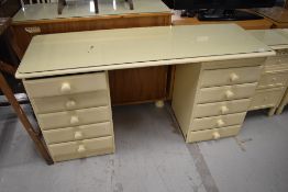 A cream painted dressing table, width approx. 145cm