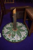 A tile mosaic parasol base