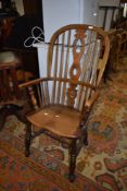 A traditional oak Windsor style high back kitchen chair