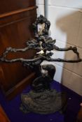 A traditional cast iron stick stand having hunting dog decoration