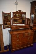 A Victorian pitch pine dressing table having triple mirror back