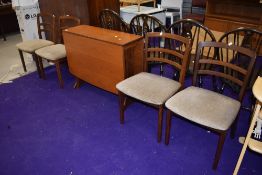 A vintage G plan or similar teak gateleg table and four rail back chairs, chairs labelled as G plan
