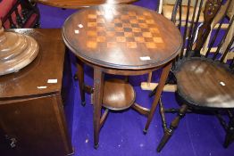 An early 20th mahogany occasional table having chequerboard top , diameter 52cm