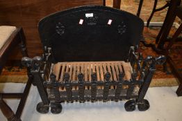 A traditional cast fire grate approx. 56 x 28cm