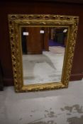 A vintage plastic gilt effect wall mirror, approx. 66 x 50cm