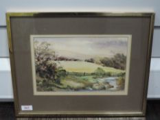 A watercolour, K Lund, Stream by Coniston, signed and attributed verso, 18 x 28cm, framed and