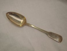 A Georgian silver table spoon of fiddle back form bearing monogram to terminal, London 1818, Solomon