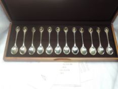 A RSPB members edition cased silver spoon collection having 12 spoons with gold plated bird