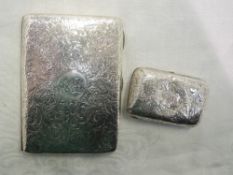 A Victorian silver aide memoire purse having engraved scroll decoration and monogrammed cartouche