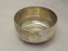 A silver bowl of plain circular form on a circular foot, London 1919, Charles Boyton & Son Ltd,