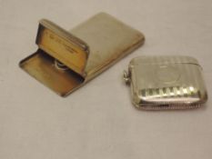 A Victorian silver card case of plain form having hinged flap lid and gilt interior bearing stamp